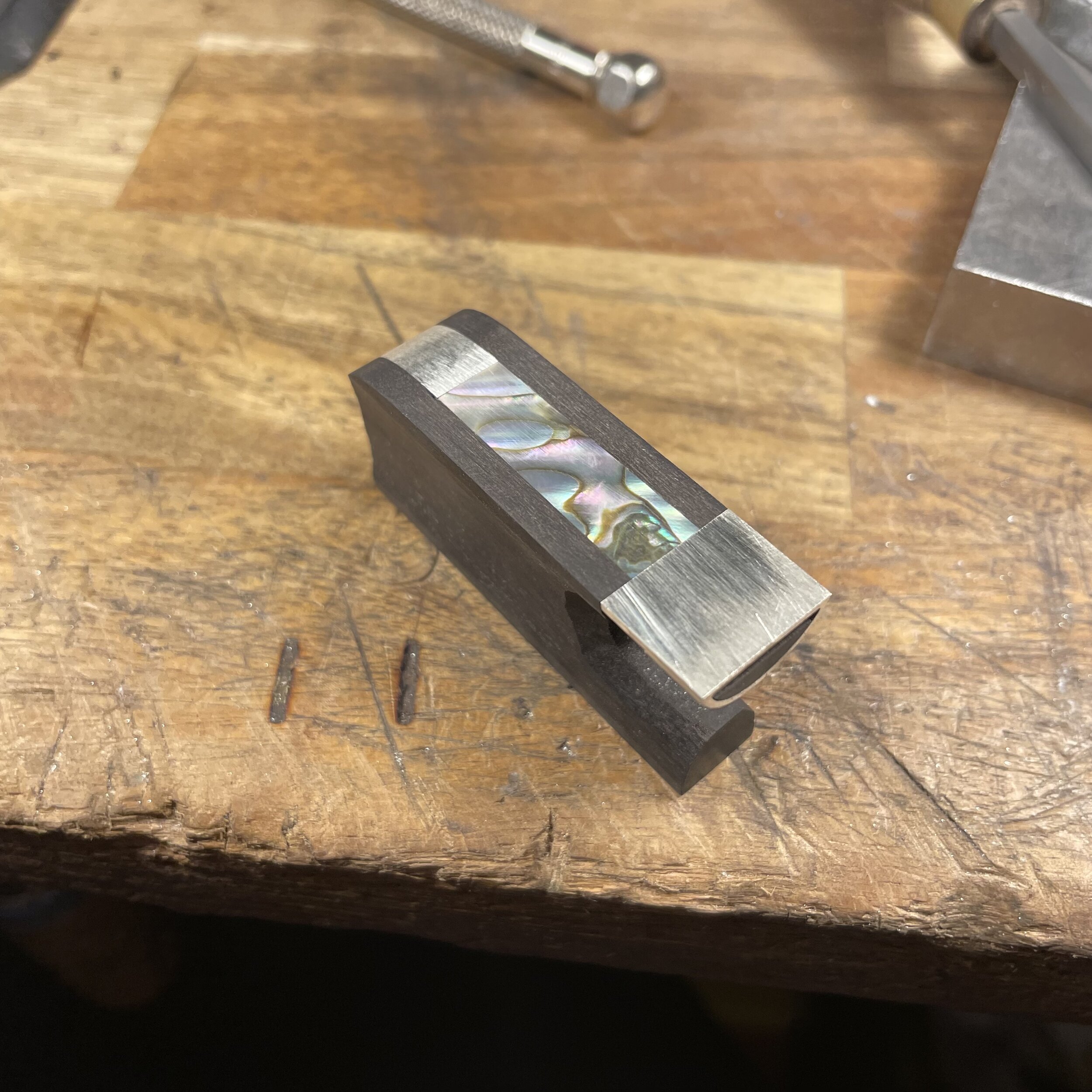 A pearl slide is then shaped to fit the channel perfectly. No gaps allowed.