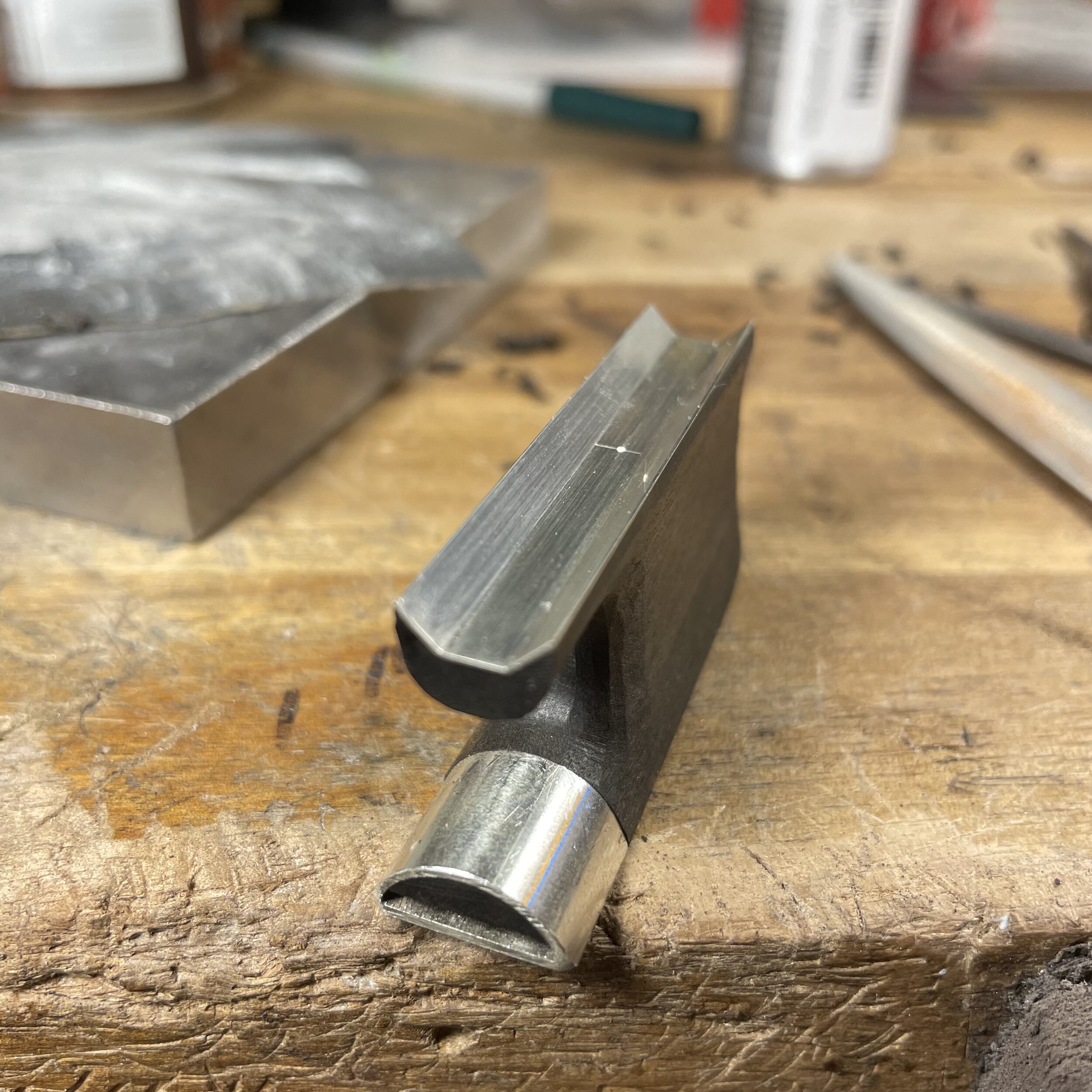 The slide channel is the part that will have the most contact with the stick so I must be extra careful to carve out the slide channel perfectly flat and square. The silver underslide is then fit to the channel and glued in place. This will protect