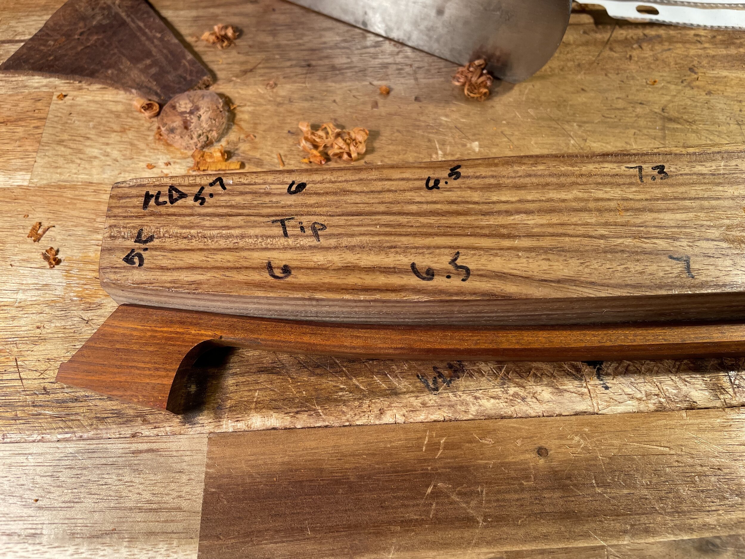 After roughing out the stick to my first graduation dimensions I carefully start to heat the bow with an alcohol lamp and bend it by hand across a rough form. In this way I create the camber and make sure the stick remains straight.