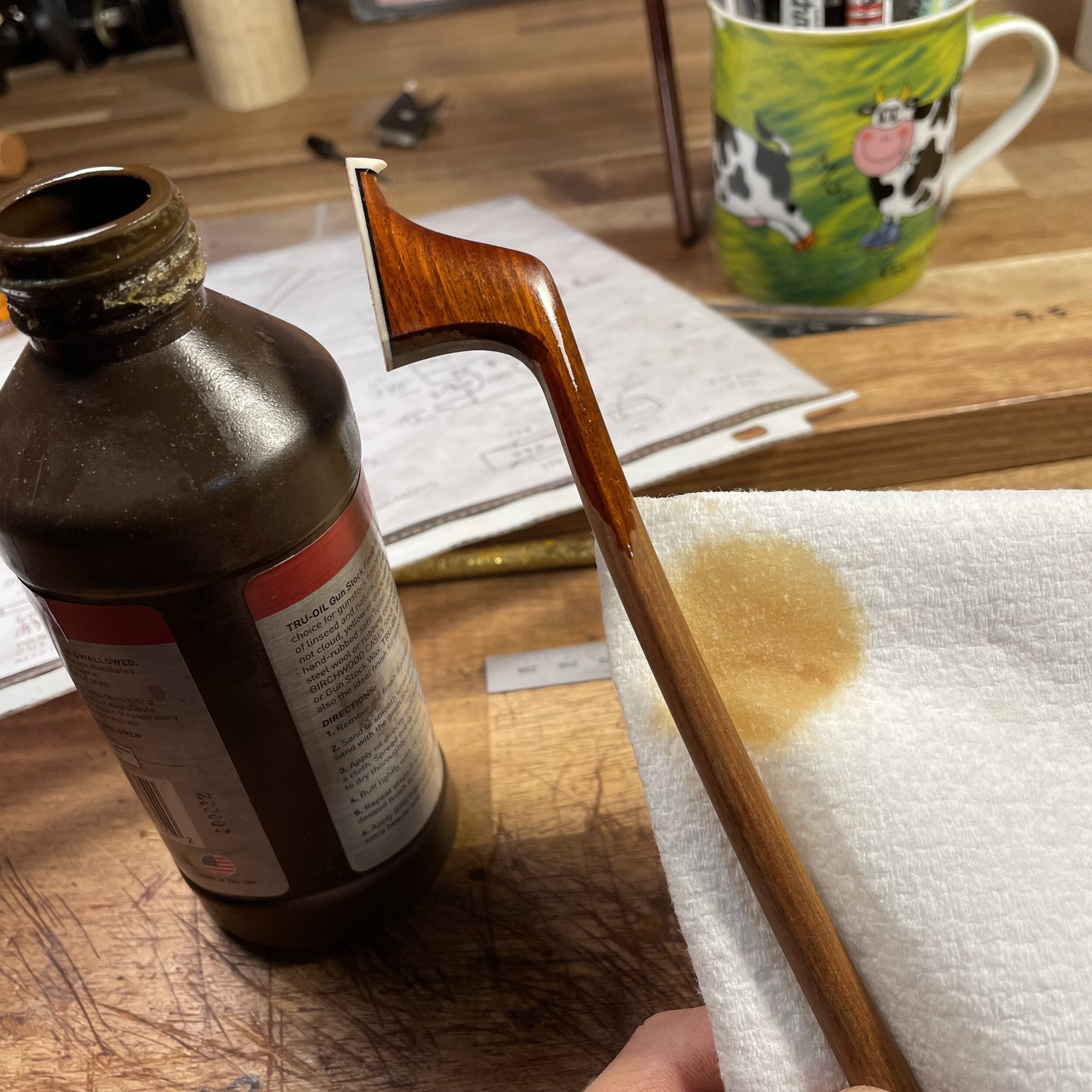 A little oil over the bow and it’s set in the sun for a few days to oxidize. The material will darken as it oxidizes and turn from a lighter clean-cut look to a more glowing finished feel. After that the bow is lightly sanded to remove the oil and